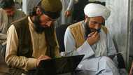 Taliban fighters swap arms for books as hundreds return to school