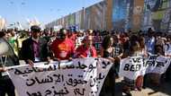 At COP27, hundreds march behind hunger striker's sister