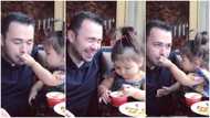 Baby spoon feeds father ice cream in adorable viral video