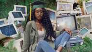 Lady shares cool artistic graduation photo posing in front of defunct computers