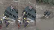 Video shows brave moment US officers rescue dad & his daughters who were stranded on their car during flood