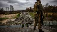 Ukrainian soldiers keep watch at recaptured border