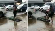 Limpopo man creates 'bridge' on flooded street and charges R2 to cross, South Africans praise his hustle