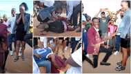Man in Suit Rolls Himself on the Ground as he Proposes to His Girlfriend