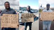 Funny placards inspire Good Samaritan to buy a house for jobless dad