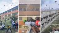 Cash rains as young man sprays money on federal university students from school balcony, video goes viral