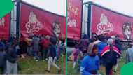 "This isn't acceptable": Simba truck looted on Francie Van Zijl Drive as crowd grabs goods and flees