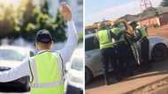 "Throwing people's fathers": 1 Big driver takes on 3 short traffic cops in clip
