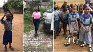 Young lady gifts shoes to poor boy who wore nylon tied sandals to school