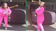 Woman celebrates Audi in TikTok video, Mzansi love her traditional dance with knobkerrie