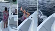 Woman partying on boat goes overboard into the ocean in viral video, peeps question her “graceful” fall