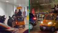 2 Johannesburg men catching ride on top Bajaj Qute car cause a frenzy in Maboneng, video trends