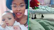 "A woman carrying the weight of the world on her shoulders": Mother sat hopelessly on baby's hospital bed