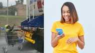 Video of man cruising in a trolley attached to a truck on the freeway in heavy rain has Mzansi perplexed