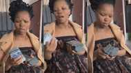 Video of man showering pretty woman with several wads of cash while telling her she must never go to her broke boyfriend again