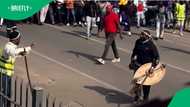 Witbank crowd of Zulu men march while carrying traditional sticks in video