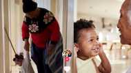 Toddler has fun at expense of gogo who is mopping hallway in funny video