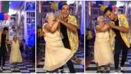 Old woman drops walking aid, busts legwork as she dances with young man, video goes viral