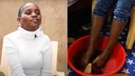 Handicapped woman who can't use her hands uses feet instead, 4 year old son helps her