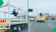 "South Africans live on a different planet": Man swings on the back of a truck on KZN highway