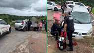 Daring move: Durban resident attempts to halt moving car by standing in its path