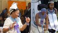 Man's return from initiation goes viral as proud mom celebrates by throwing bottle of Hennessy in the air, SA in awe of stunnng pics