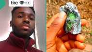 "You're a billionaire": Reactions as young Nigerian man shows off rare stone he found on hill