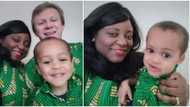 Social media users gush as lady, her hubby and son storm England birthday party in native wear