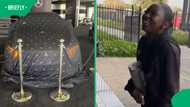 Parents surprise daughter with her first luxury car at dealership