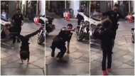 Video of kid and cop 'causing it' in epic streetside dance battle goes viral