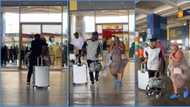 Man welcomes his beautiful and curvy US lover at airport, hugs her tight