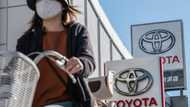 Toyota third-quarter net profit drops but keeps full-year forecasts