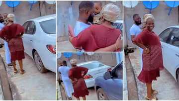 Priceless moment mum blushes as son wows her with a car, busts into prayer in video