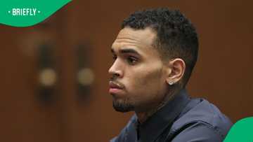 CCTV shows Chris Brown striking man with a tequila bottle in London nightclub brawl