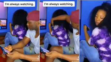 Woman spies on bae's phone using huge curly wig, hilarious video defeats Mzansi, "After God, fear women"