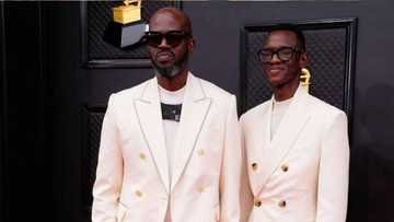 Black Coffee's Christmas photo with son Esona gets Mzansi talking: "Where is his white girlfriend?"