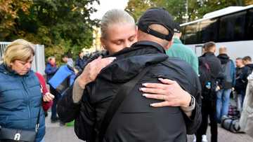 'Just military exercises, right?': families send off Russian reservists