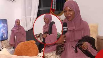Tanzanian woman with huge snake pet claims it helps her get rich