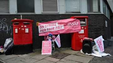 UK rail, postal staff halt strikes after queen's death