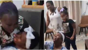 Video shows woman rolling on the floor and screaming in excitement as daughter arrives from us after 10 years