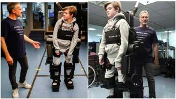 Son who has been on wheelchair walks after father built a robot for him that moves his legs and arms