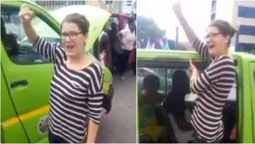 Reactions as video of white lady serving as taxi assistant surfaces