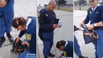 Video of SAPS searching woman’s bag gets the people of Mzansi talking, angered lady claims they stole her cash