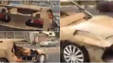 Man constructs sports car with scrap iron and carton, cruises around town in it