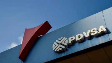 A Swiss and an Argentine were charged in Miami Tuesday with helping launder part of $1.2 billion taken from Venezuelan state oil firm PDVSA in a long-running corruption and bribery investigation.