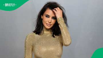 Kim Kardashian falls while wearing high heels on her way to Oscars afterparty: "My ankles"