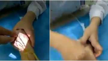 Video shows doctor using vein finder to locate veins, many react