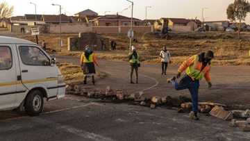 Mogale City shutdown: Protest action leaves 1 dead, residents burn shacks while hunting down illegal miners