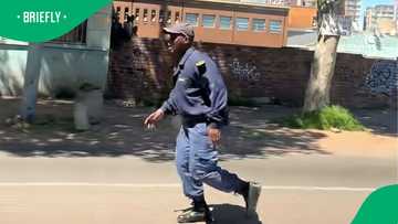 South Africans divided over video of SAPS officer running from crowd