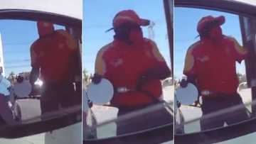 “Simply happy”: Mzansi wowed by petrol attendant filmed in video jamming to song